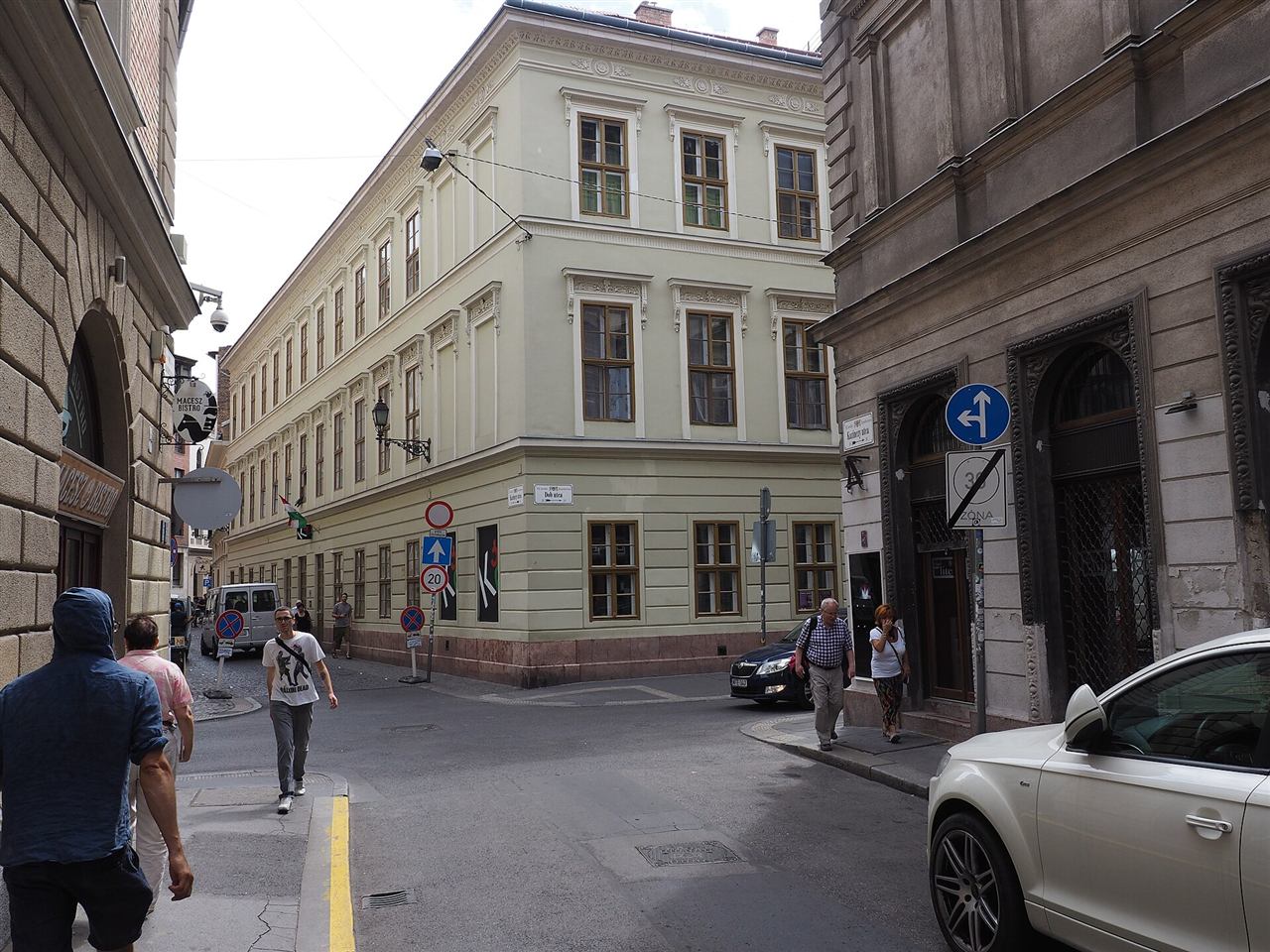 Street view along Kazinczy utca in Budapest's Jewish Quarter, lined with historic buildings